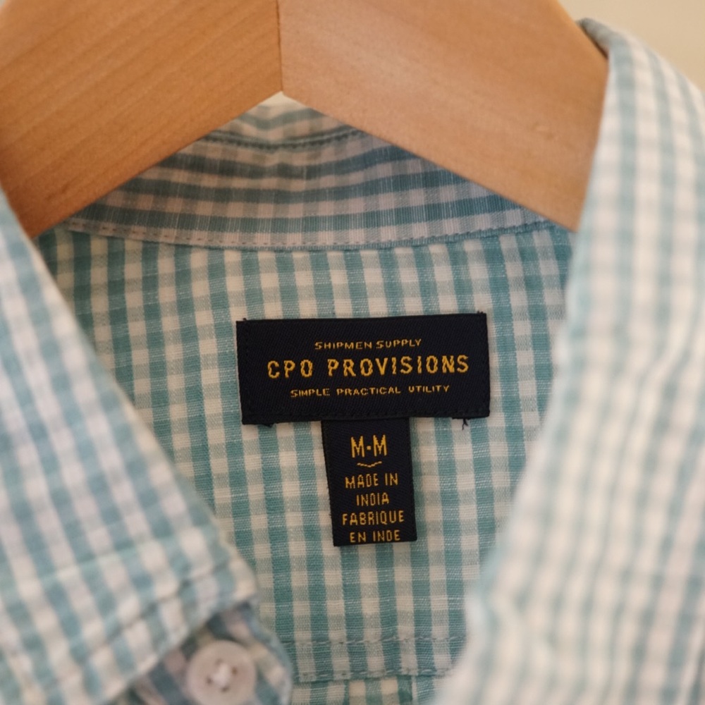 Coo provisions button up